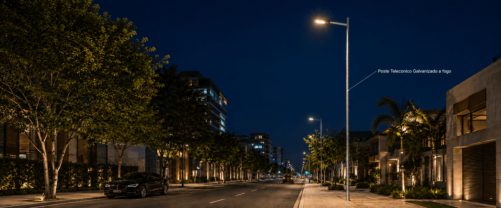 Avenida iluminada à noite por postes telecônicos galvanizados a fogo, um após o outro ao longo da via